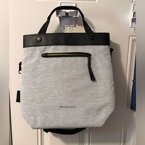 Sherpani Geo silver front/black back crossbody with top handles.